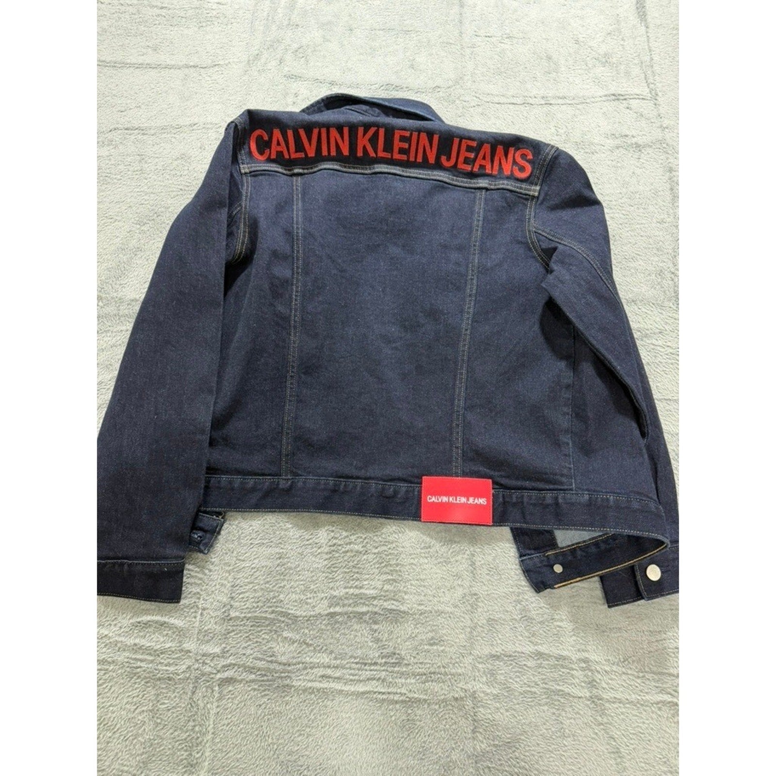 Calvin Klein Jeans Womens Small Dark Indigo Denim Trucker Jacket Red Logo Back