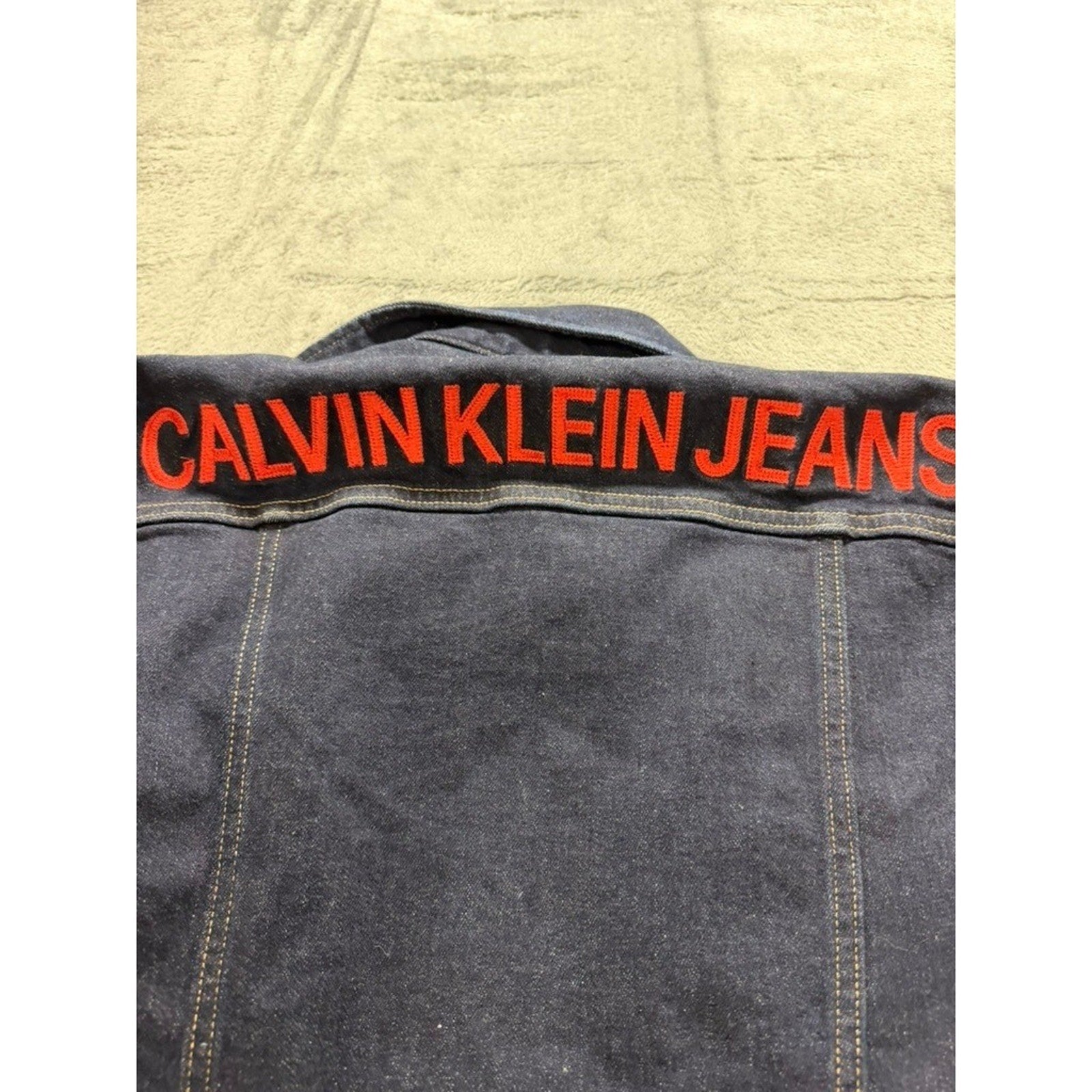 Calvin Klein Jeans Womens Small Dark Indigo Denim Trucker Jacket Red Logo Back