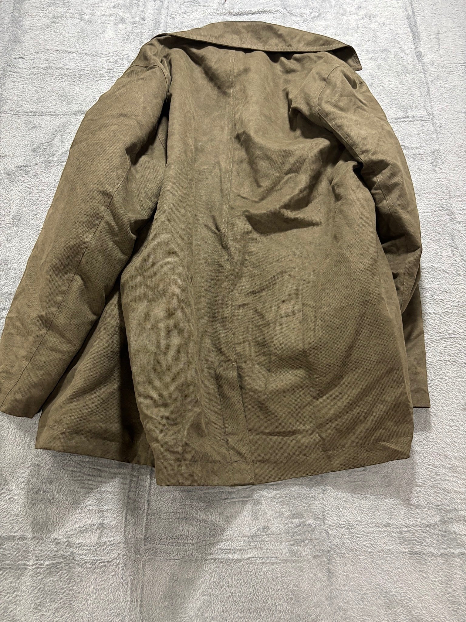 Back view of a My Second Story vintage olive green field jacket with a durable weatherproof exterior.