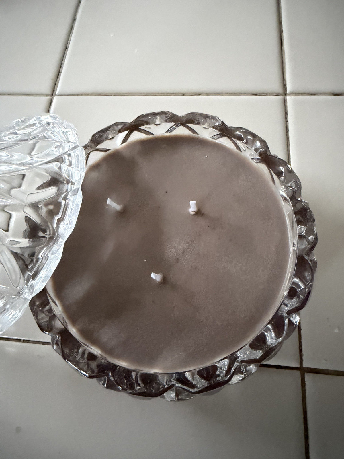 Top view of Sealed With a Kiss showing brown soy wax and three wicks