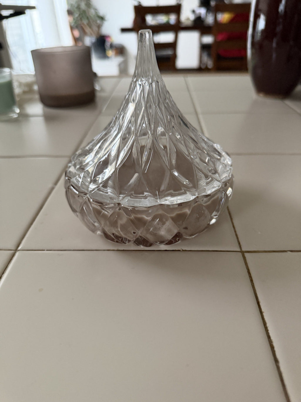 Front view of the lidded glass candle dish